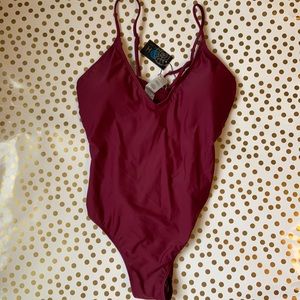 One piece bathing suit w/ cut open sides